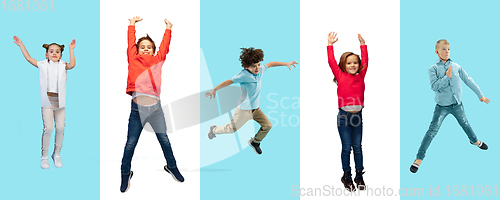 Image of Group of elementary school kids or pupils jumping in colorful casual clothes on bicolored studio background. Creative collage.