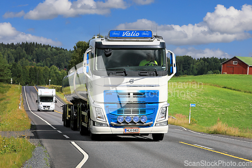 Image of Blue White Volvo Milk Tanker on Road