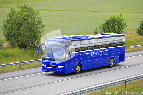 Image of Blue Volvo Bus Bygdaleidir on Road in Finland