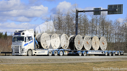 Image of Volvo FH Truck Transports Cable Reels on Flatbed Trailer