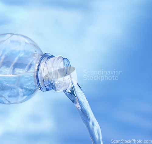 Image of Blue bottle pouring water