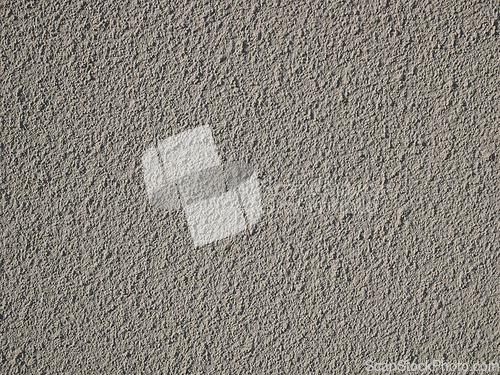 Image of Detail of bumpy concrete wall painted in gray color
