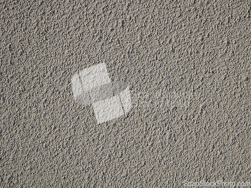 Image of Detail of bumpy concrete wall painted in gray color