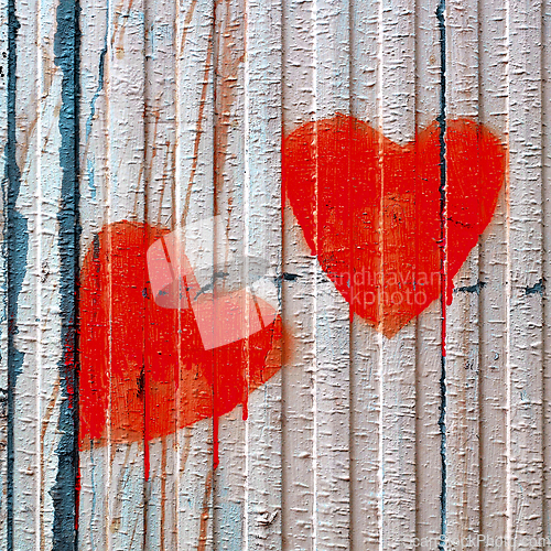 Image of Red Valentine loving hearts on an old wooden fence