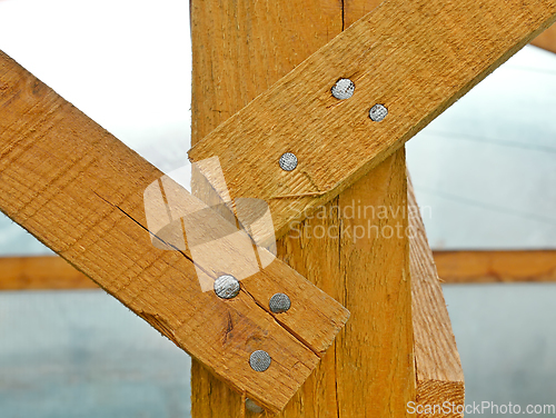 Image of Fragment of the wooden base of the greenhouse frame