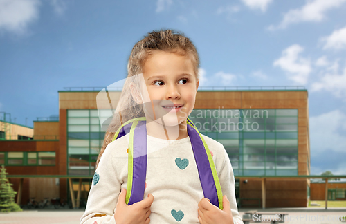 Image of happy little girl with school backpack