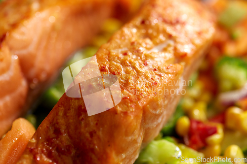 Image of close up of baked salmon fish with vegetables