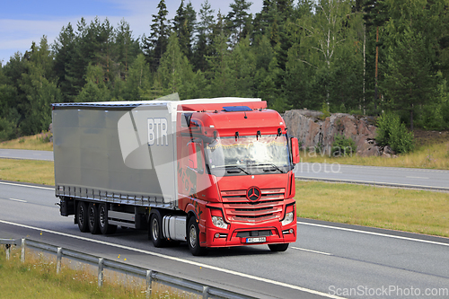 Image of Red Mercedes-Benz Semi Trailer Truck on Motorway