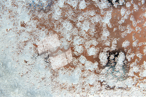 Image of glass covered in snow and ice after blizzard