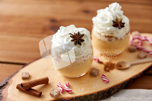 Image of glasses of eggnog with whipped cream and anise