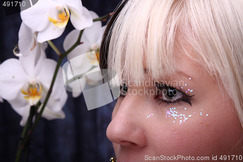 Image of Woman and orchid