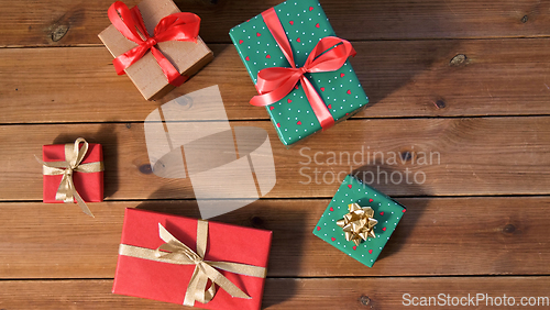 Image of christmas gifts on wooden boards