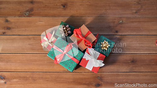 Image of christmas gifts on wooden boards