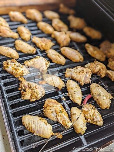 Image of Chicken meat fried on a barbecue grill