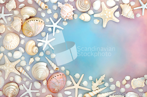 Image of Seashell Collection on Rainbow Sky Cloud Background