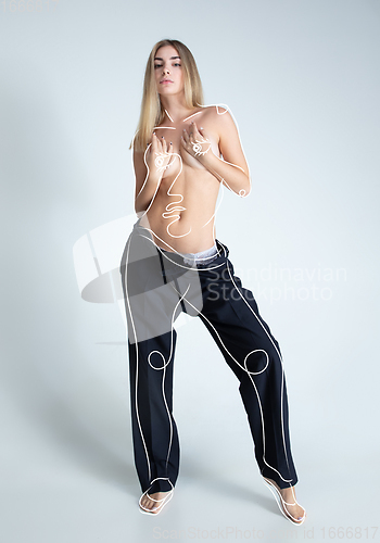 Image of Young blonde beautiful naked woman with line art drawing illustration on body