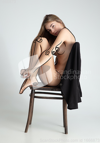 Image of Young blonde beautiful naked woman with line art drawing illustration on body