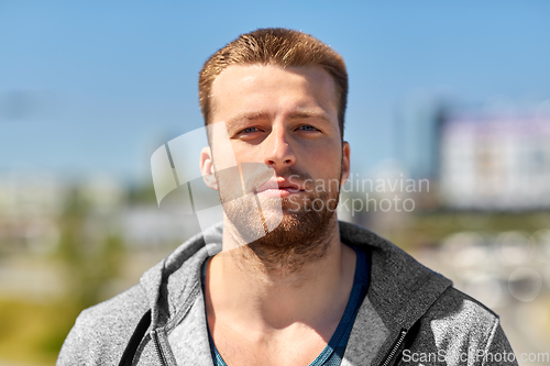 Image of portrait of young man outdoors