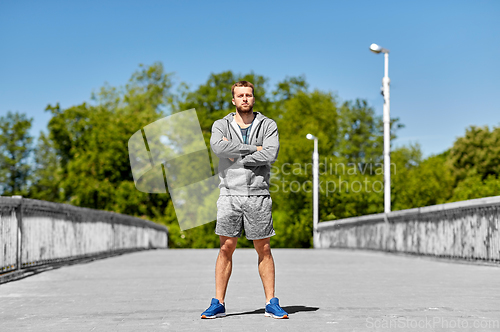 Image of portrait of young man outdoors