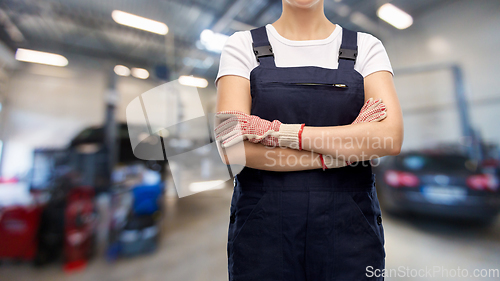 Image of close up of female worker at car service