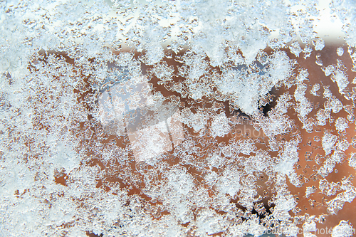 Image of window glass covered with snow in winter