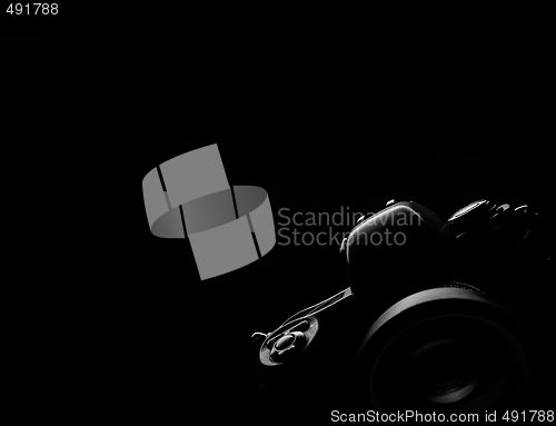 Image of Black background slr camera contour