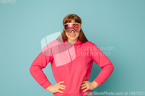 Image of Caucasian woman\'s portrait isolated on blue studio background with copyspace