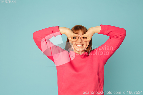 Image of Caucasian woman\'s portrait isolated on blue studio background with copyspace