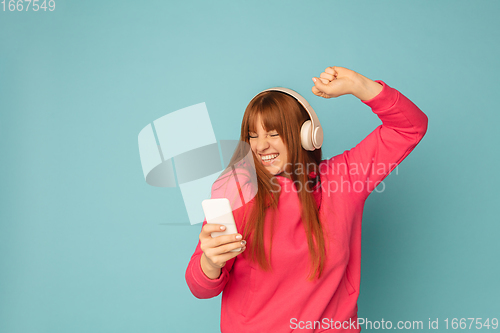 Image of Caucasian woman\'s portrait isolated on blue studio background with copyspace