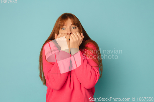 Image of Caucasian woman\'s portrait isolated on blue studio background with copyspace