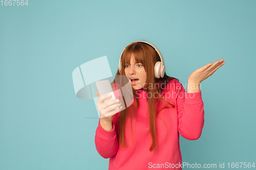 Image of Caucasian woman\'s portrait isolated on blue studio background with copyspace