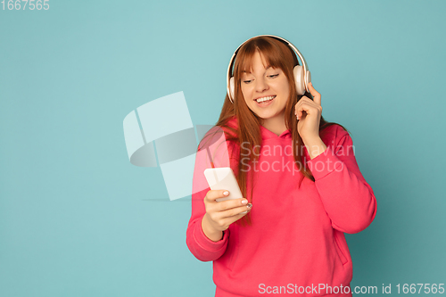 Image of Caucasian woman\'s portrait isolated on blue studio background with copyspace