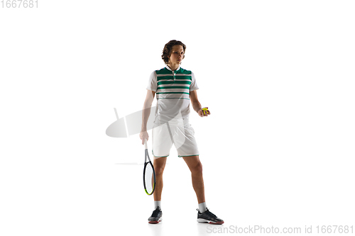 Image of Young caucasian professional sportsman playing tennis isolated on white background