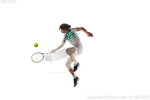 Image of Young caucasian professional sportsman playing tennis isolated on white background