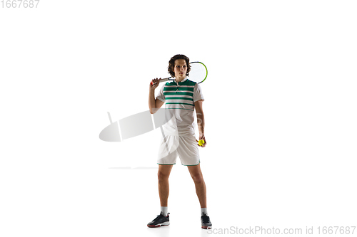 Image of Young caucasian professional sportsman playing tennis isolated on white background