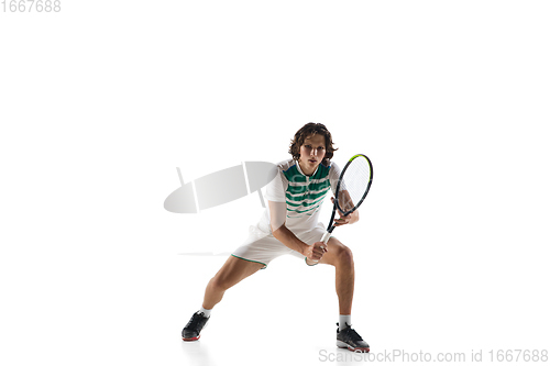 Image of Young caucasian professional sportsman playing tennis isolated on white background