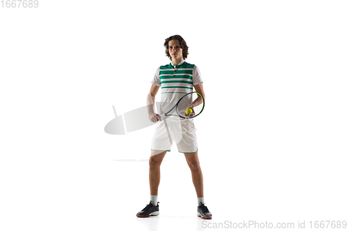 Image of Young caucasian professional sportsman playing tennis isolated on white background