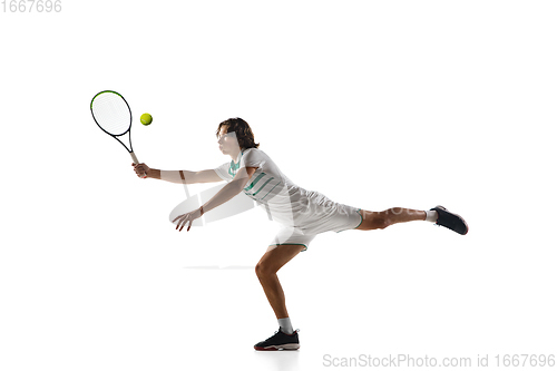 Image of Young caucasian professional sportsman playing tennis isolated on white background