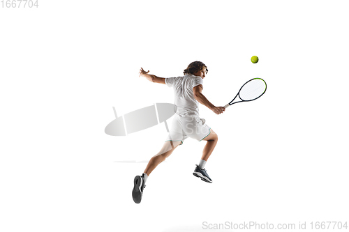 Image of Young caucasian professional sportsman playing tennis isolated on white background