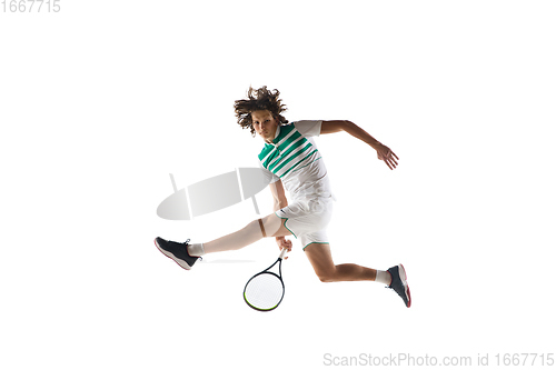 Image of Young caucasian professional sportsman playing tennis isolated on white background