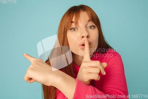 Image of Caucasian woman\'s portrait isolated on blue studio background with copyspace