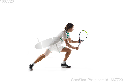 Image of Young caucasian professional sportsman playing tennis isolated on white background