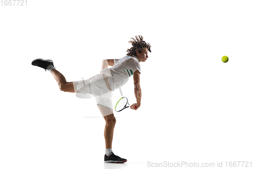 Image of Young caucasian professional sportsman playing tennis isolated on white background