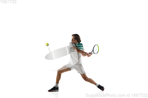 Image of Young caucasian professional sportsman playing tennis isolated on white background