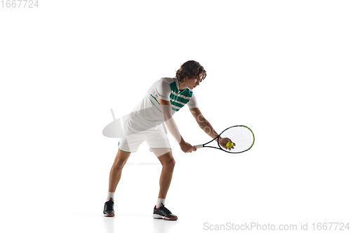 Image of Young caucasian professional sportsman playing tennis isolated on white background