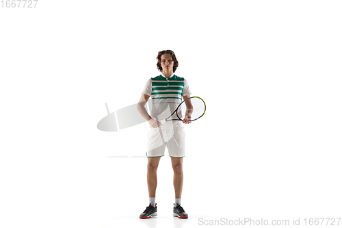 Image of Young caucasian professional sportsman playing tennis isolated on white background