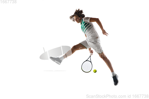 Image of Young caucasian professional sportsman playing tennis isolated on white background