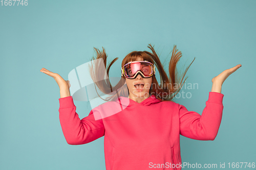 Image of Caucasian woman\'s portrait isolated on blue studio background with copyspace