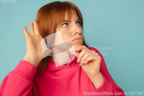 Image of Caucasian woman\'s portrait isolated on blue studio background with copyspace