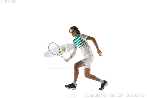 Image of Young caucasian professional sportsman playing tennis isolated on white background